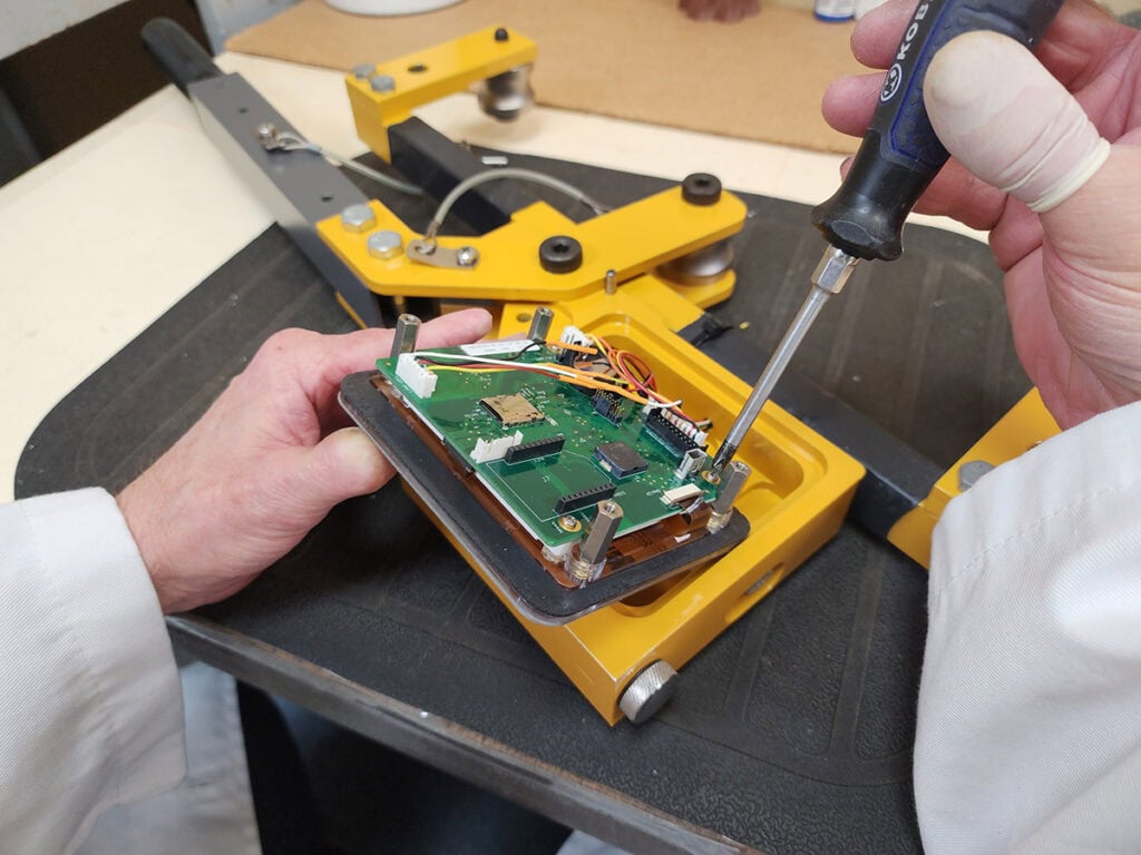 Dillon QuickCheck repairing circuit board Dillon QuickCheck repair for circuit board